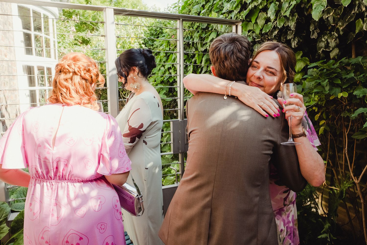 A series of candid dance photos showing couples embracing and dancing together in a garden setting.
