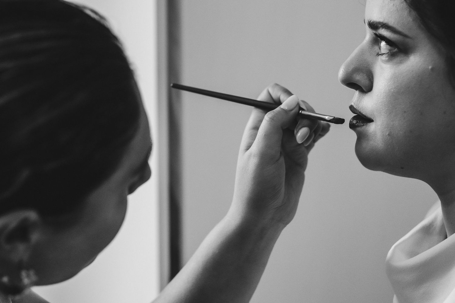Black and white photo sequence showing a person using an inhaler for asthma medication.