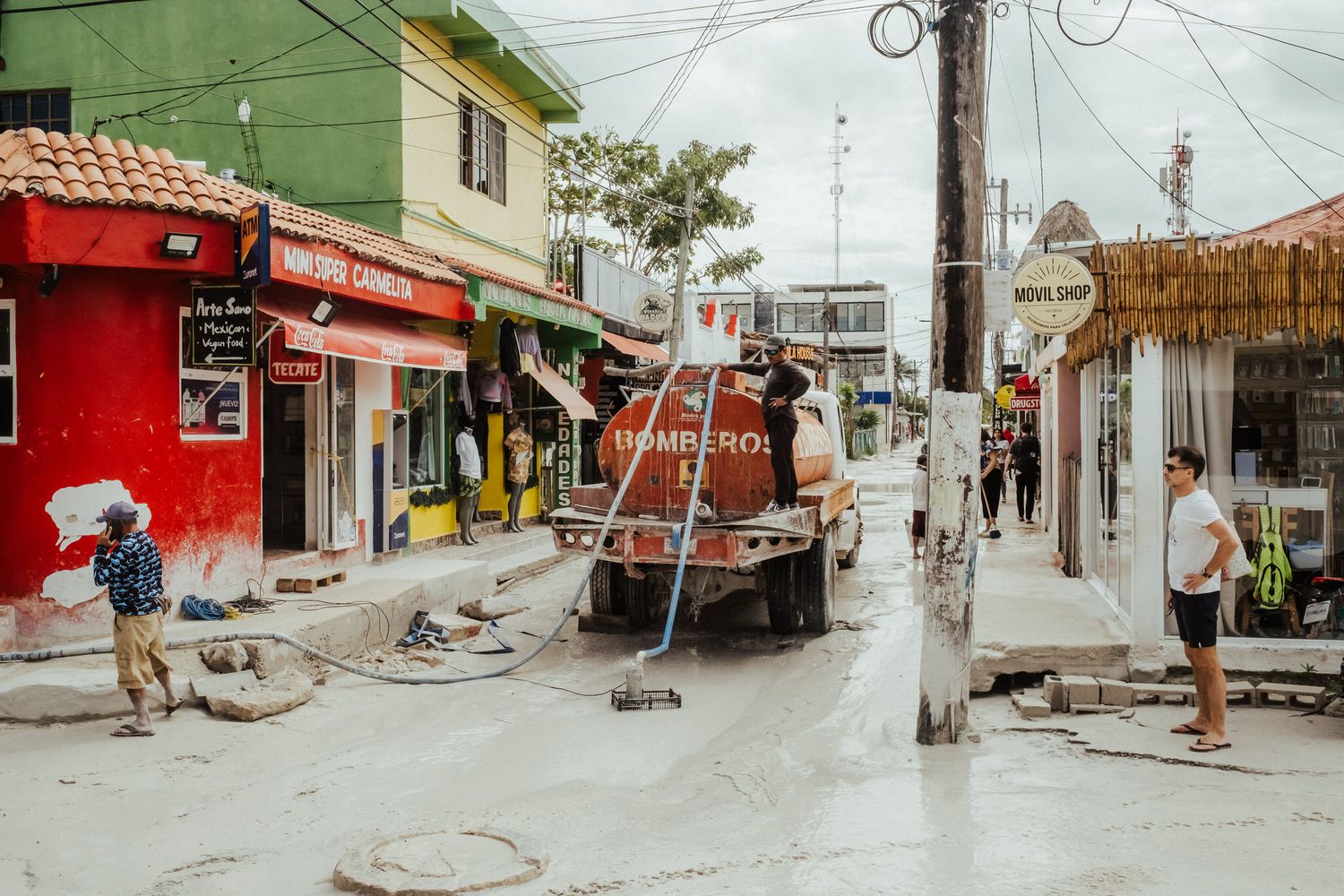 A series of six connected photos showing colorful streets and buildings in a tropical beach town during daytime.