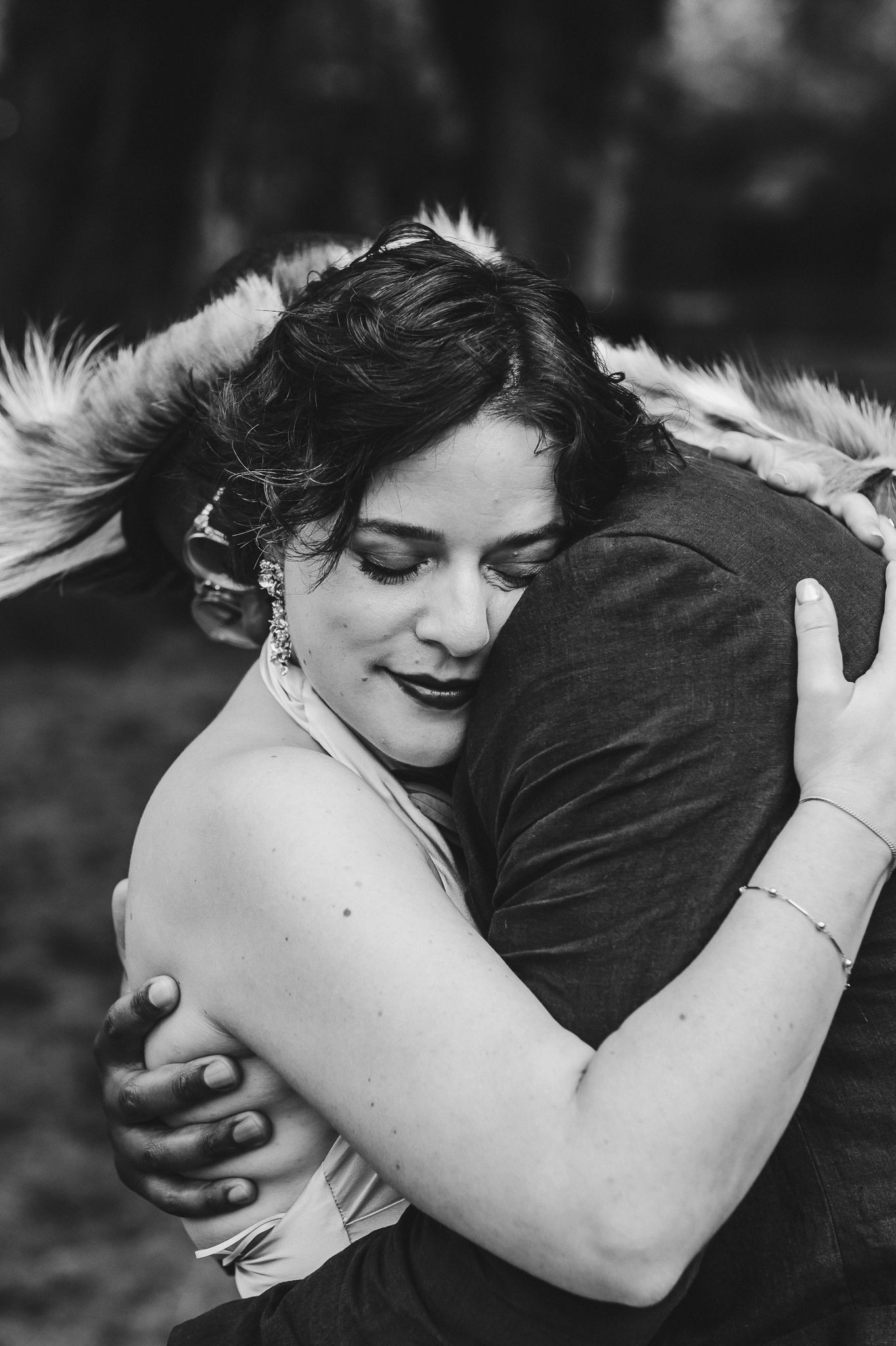 Black and white photo sequence showing a couple in an intimate embrace, with the focus on their close physical connection.