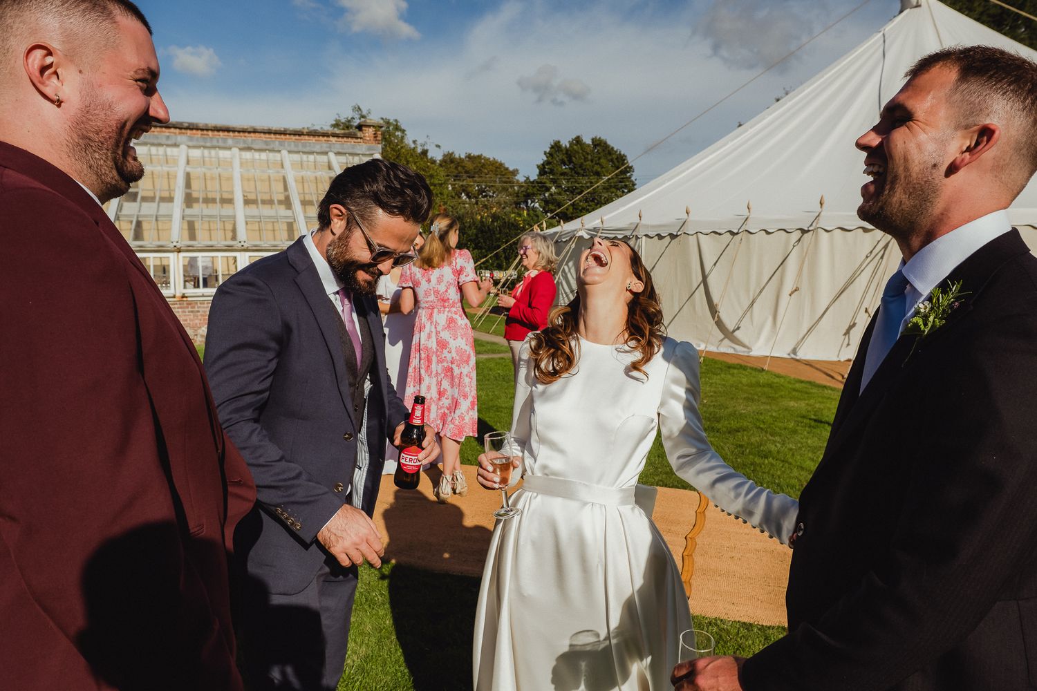 A series of candid wedding moments captured at an outdoor venue with white tents and guests mingling on the lawn.