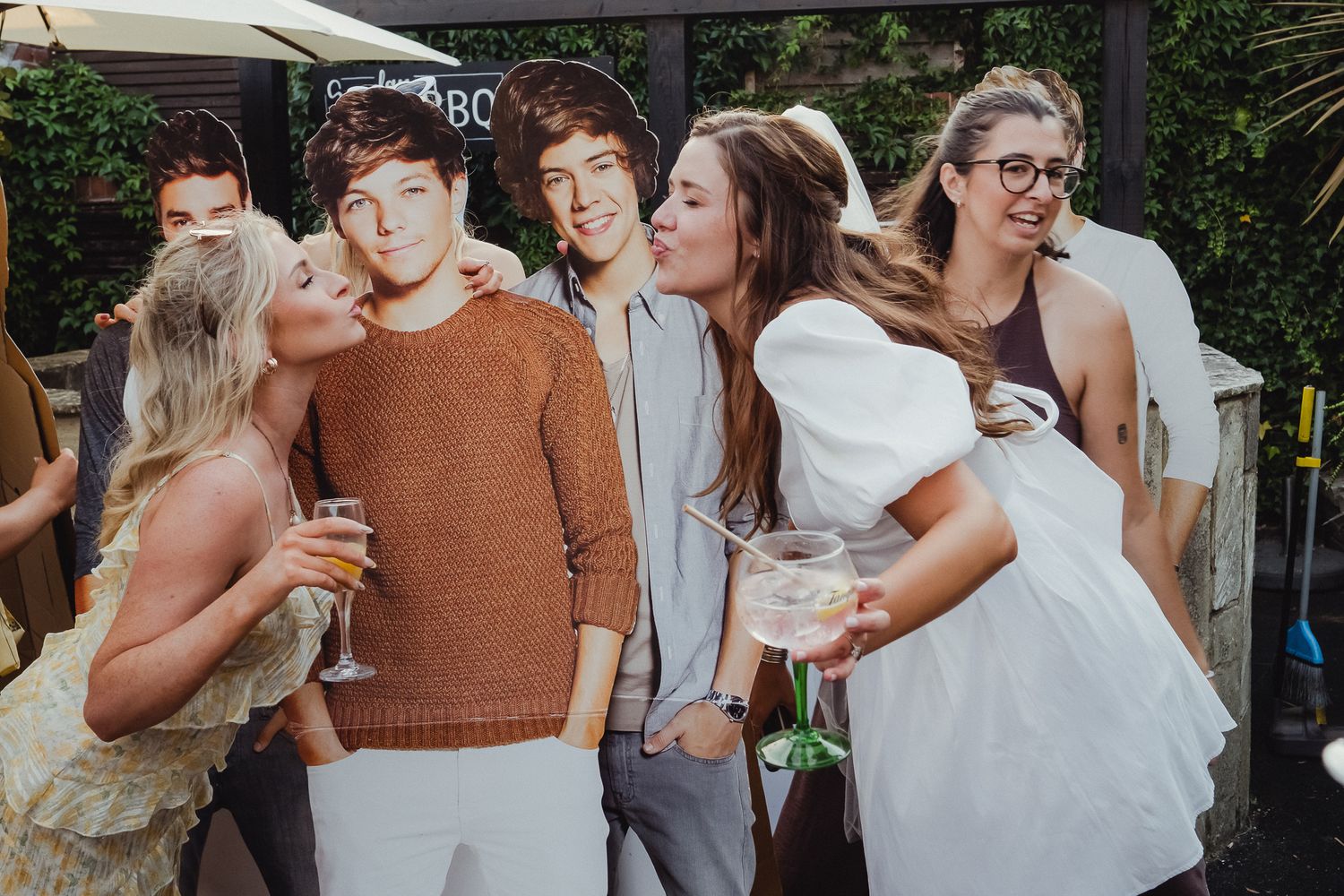 A series of candid wedding celebration moments showing joyful interactions between guests and the wedding party at an outdoor venue.