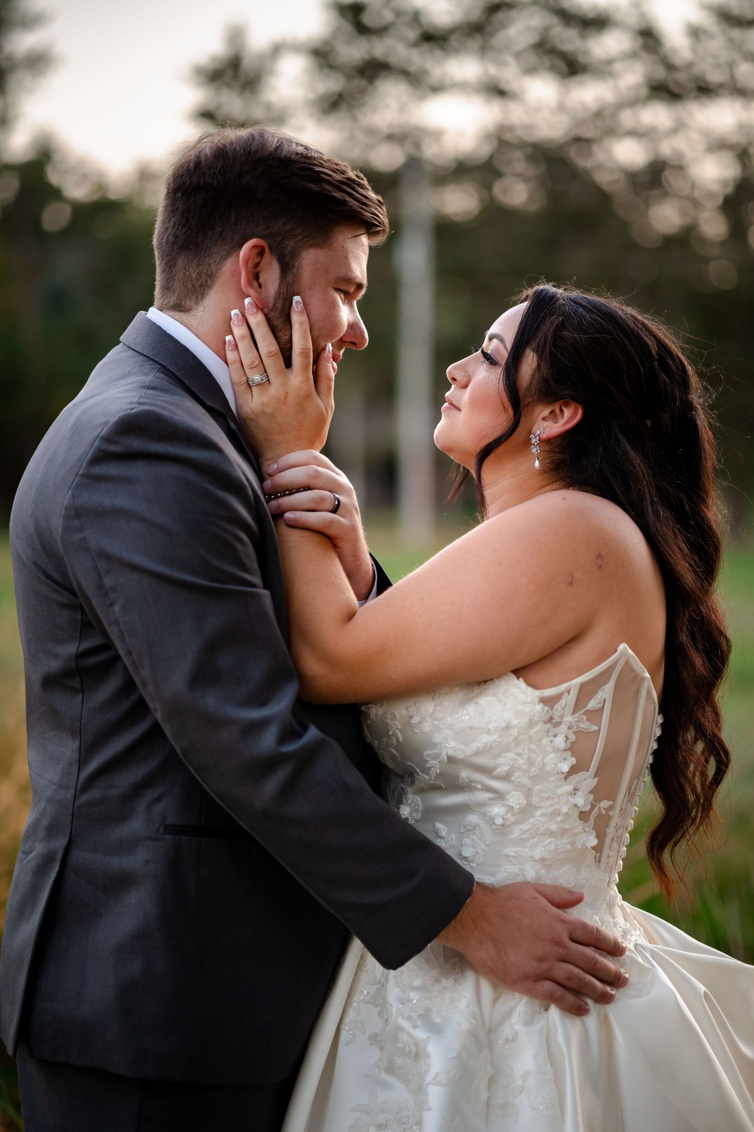 A romantic sequence of wedding photos shows a couple sharing an intimate kiss outdoors at sunset.