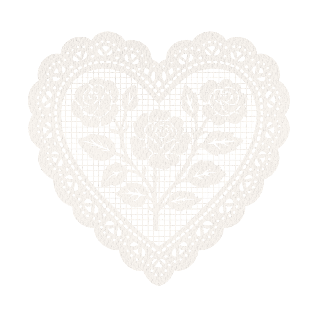 Delicate white lace heart-shaped doily with intricate floral rose pattern and scalloped edges.