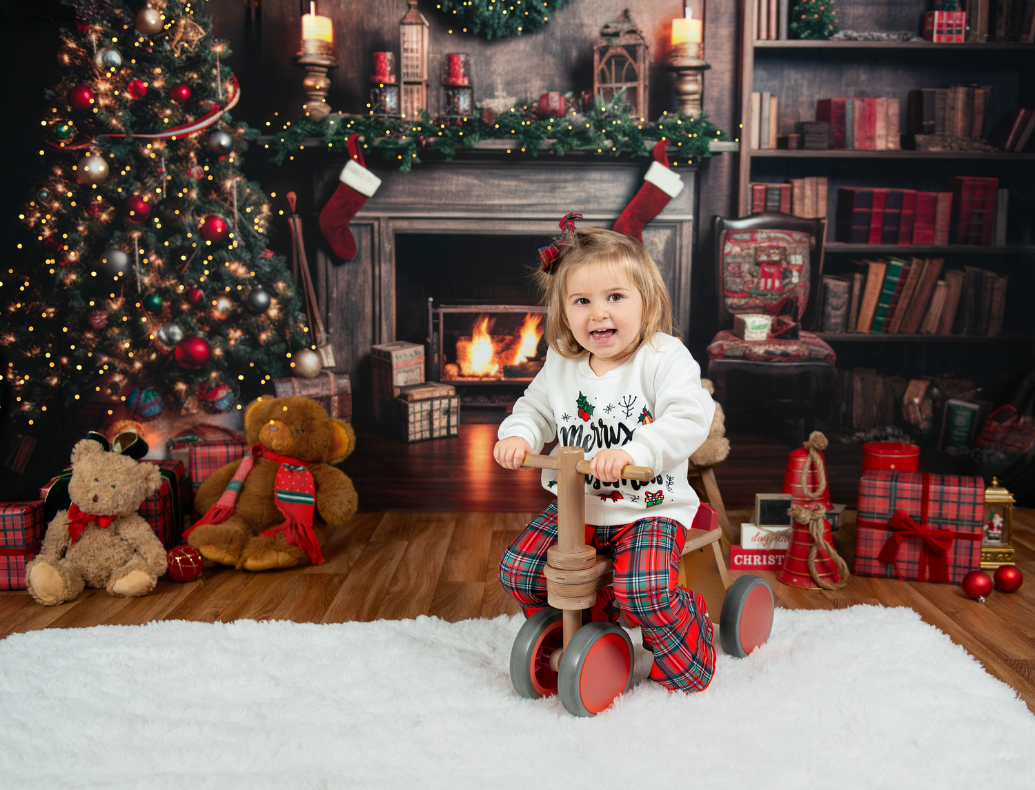 Cozy Christmas scene with decorated tree, fireplace, teddy bears, presents and child on vintage tricycle.