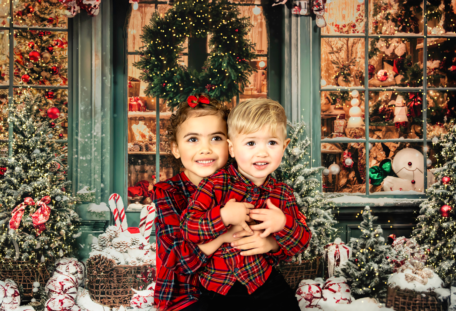 Festive holiday scene with window decorations, Christmas greenery, and red plaid accent pieces.