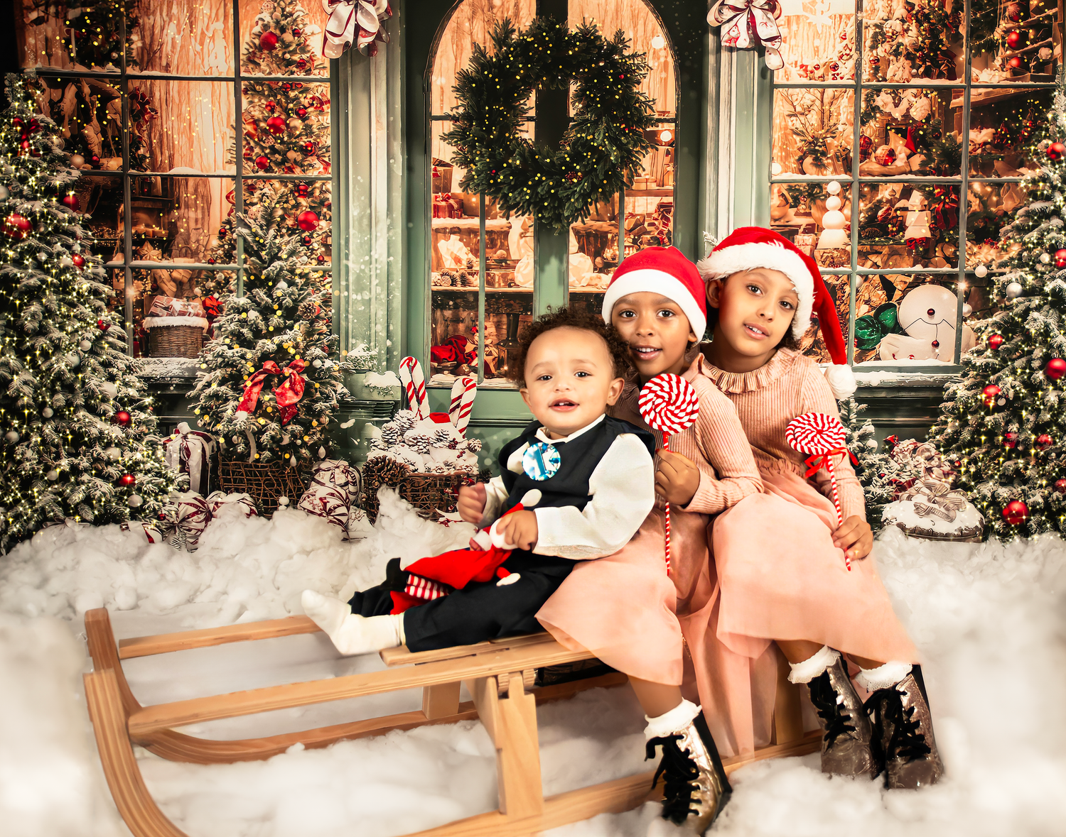 People sitting on a wooden bench during winter with festive red and green decorations and snow in the background.