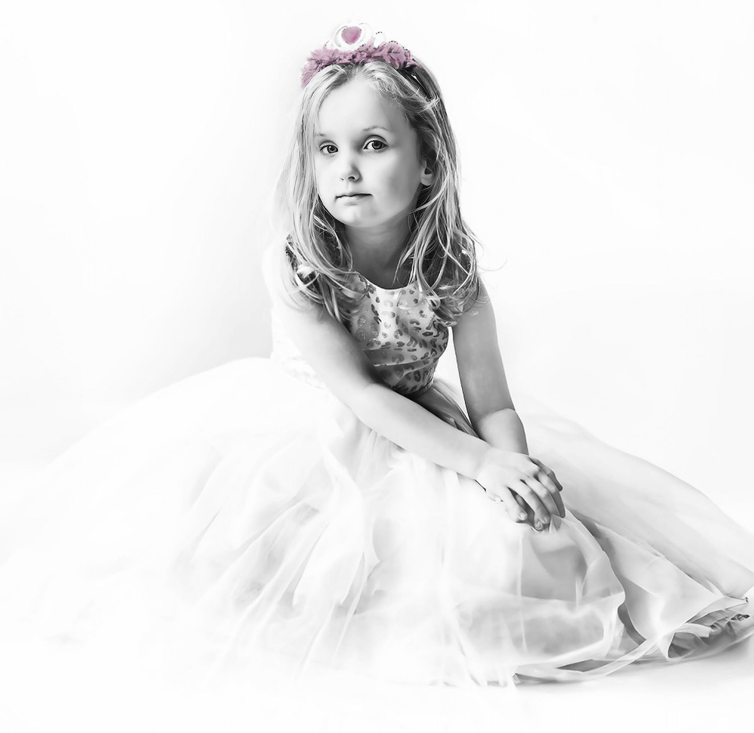 Ethereal black and white portrait series featuring soft white fabric and dreamy lighting effects.