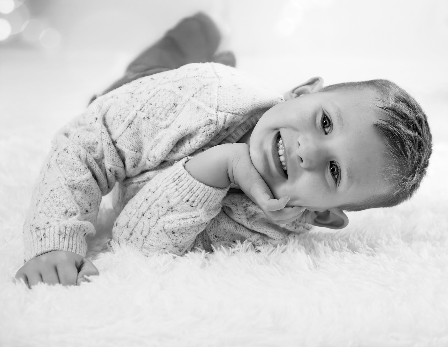 A series of black and white photos showing a person lying down and resting peacefully on white bedding.