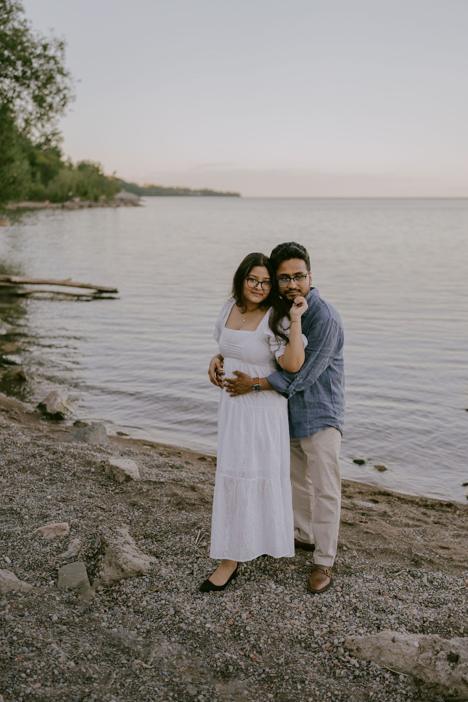 Romantic couple portrait on lakeshore Ontario at golden hour