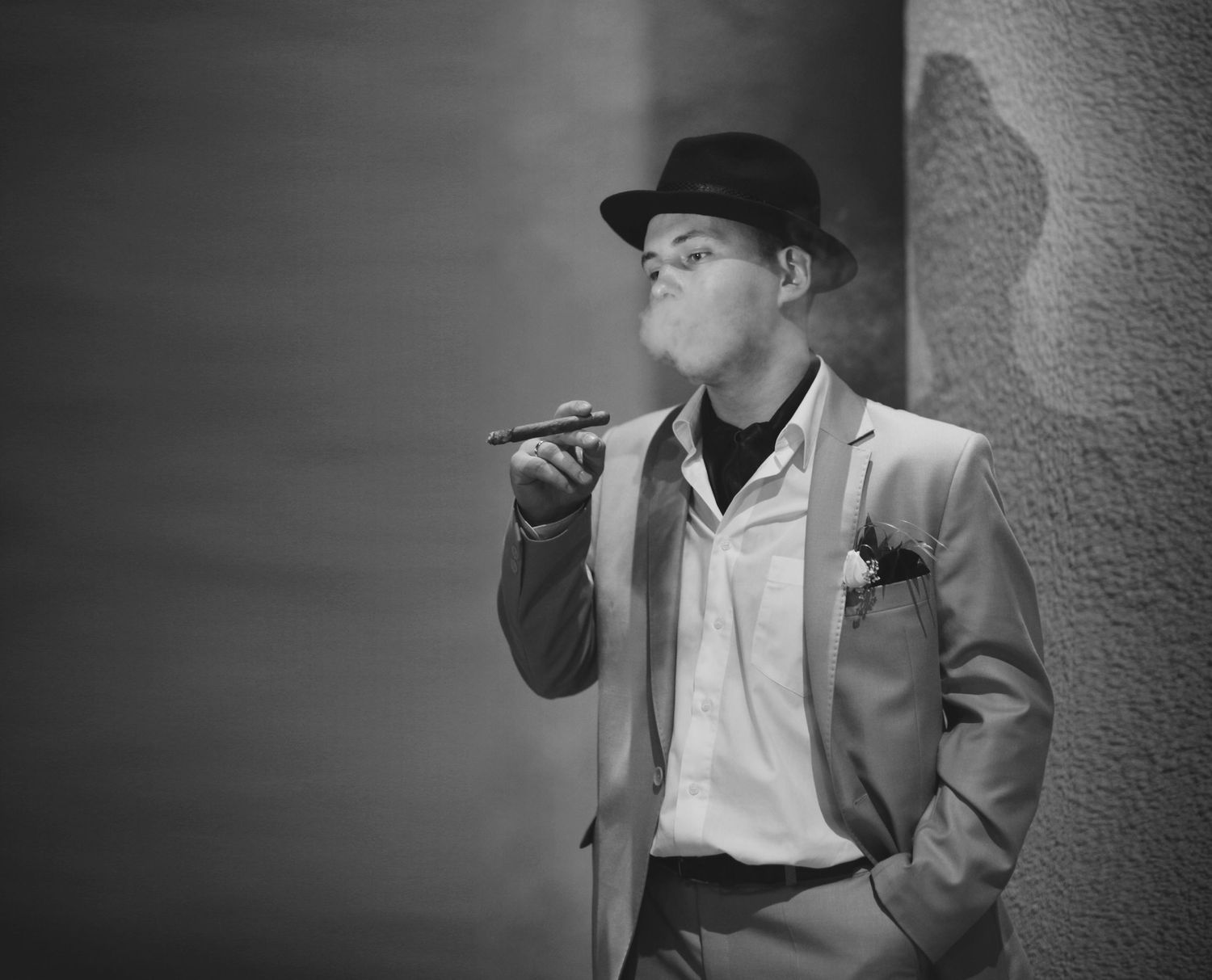 Stylish black and white portrait of groom in vintage attire holding a cigar  in Oshawa, available throughout Toronto and Durham region