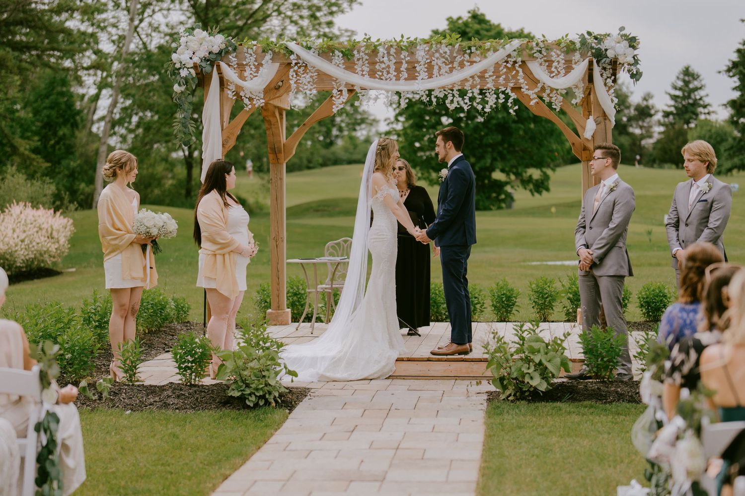 Joyful bride and groom laughing together during outdoor wedding photoshoot in Oshawa, serving Toronto, Durham Region, and beyond