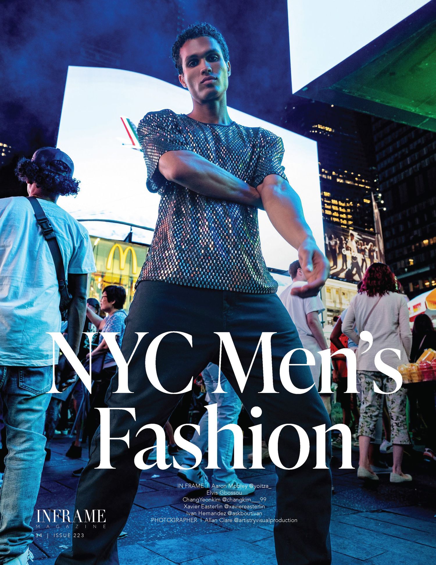 A male model poses in a sequined top on a busy NYC street for Inframe Men's Fashion editorial.