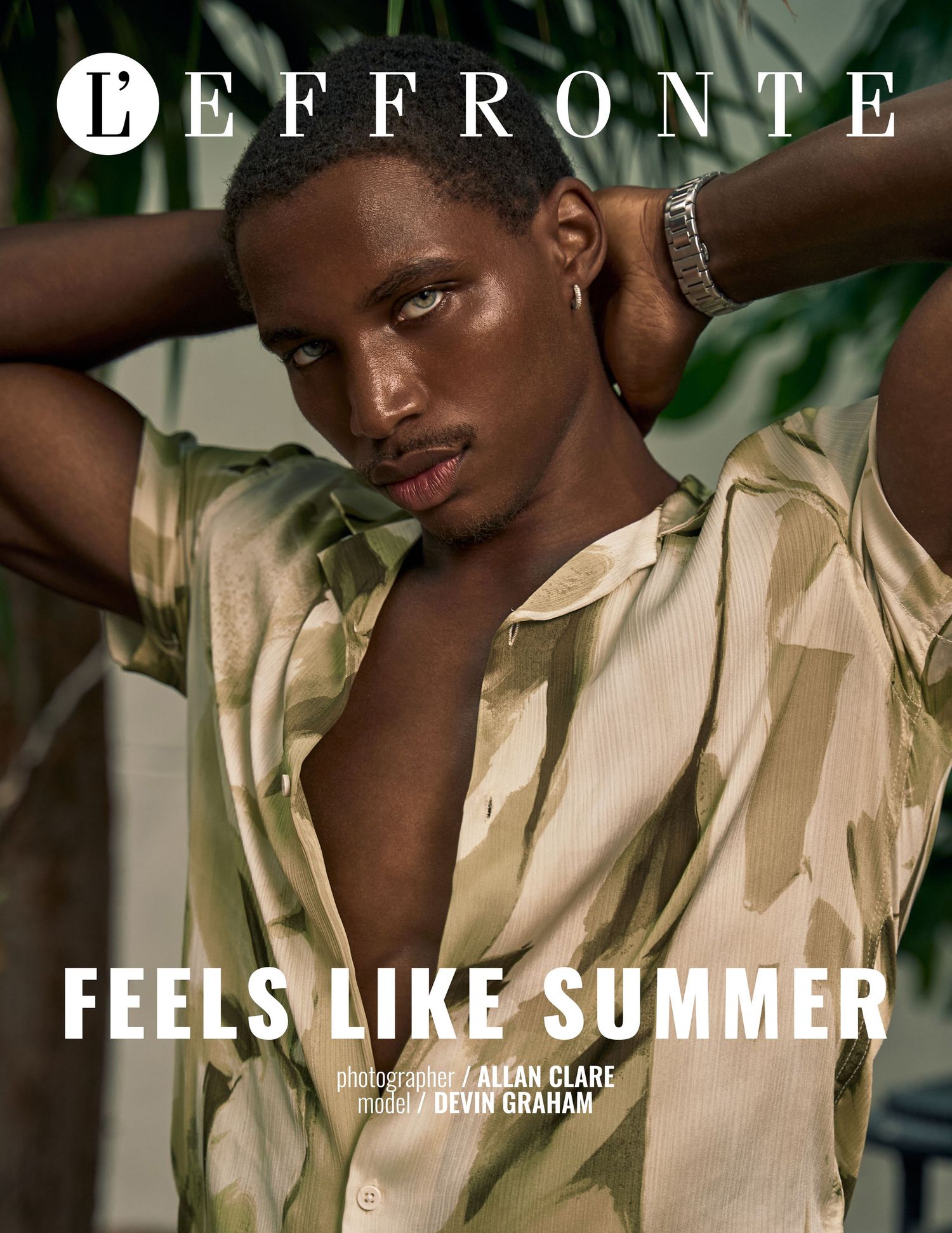 Male model Devin Graham poses for L'Effronte magazine in an open floral shirt for a summer editorial.