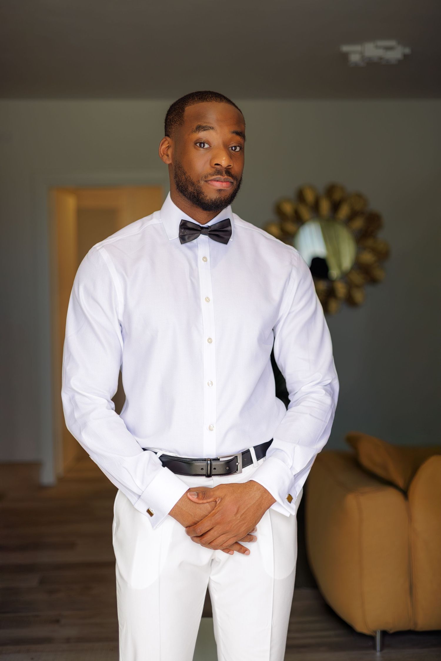 groom preparing for wedding captured with cinematic detail
