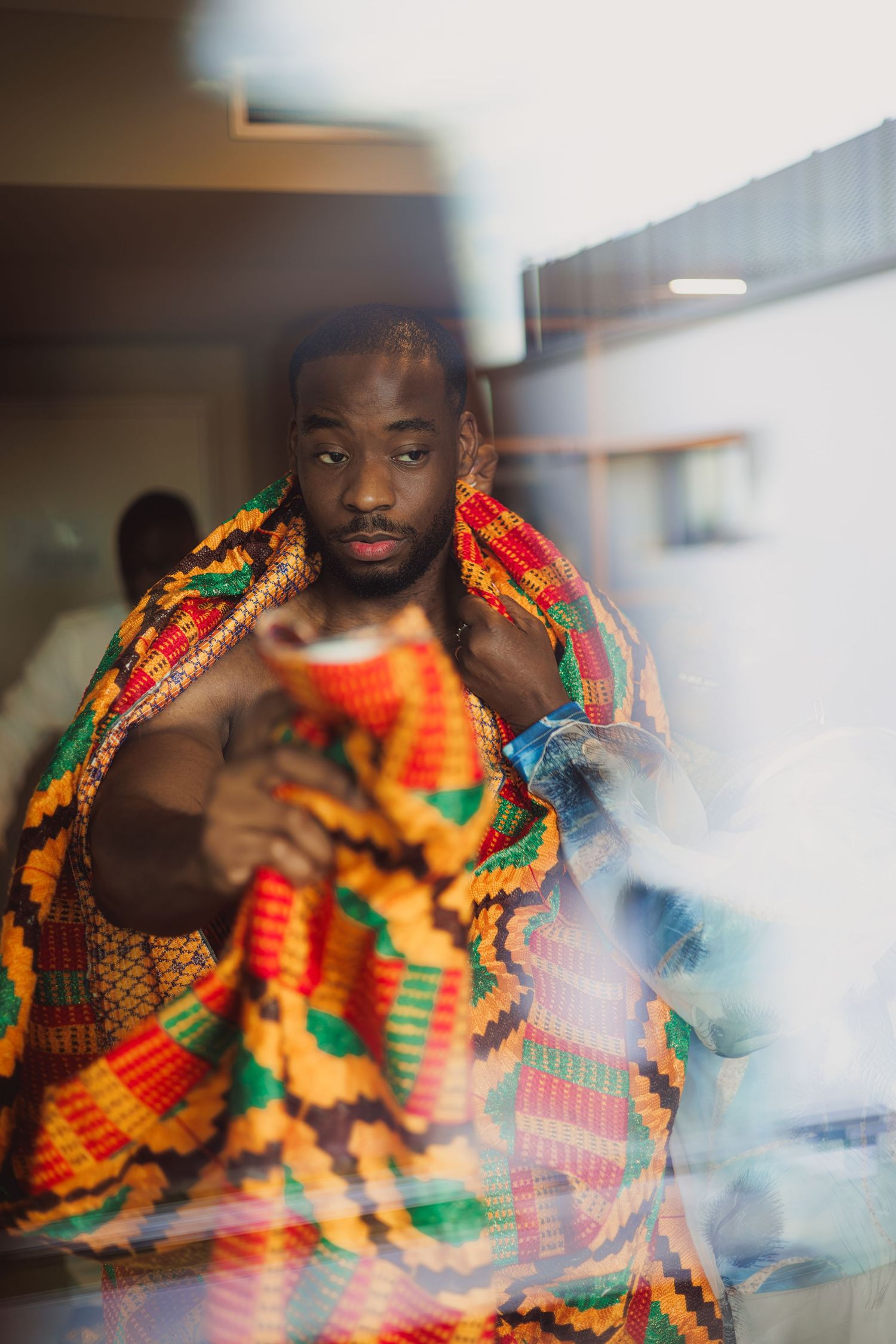 groom preparing for wedding captured with cinematic detail