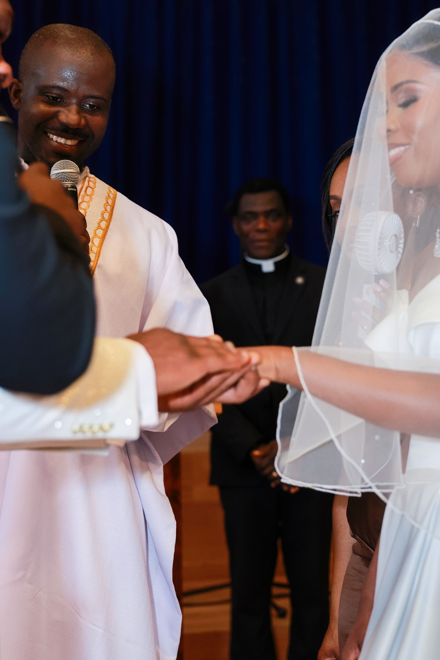 bride and groom exchanging rings during elegant wedding ceremony