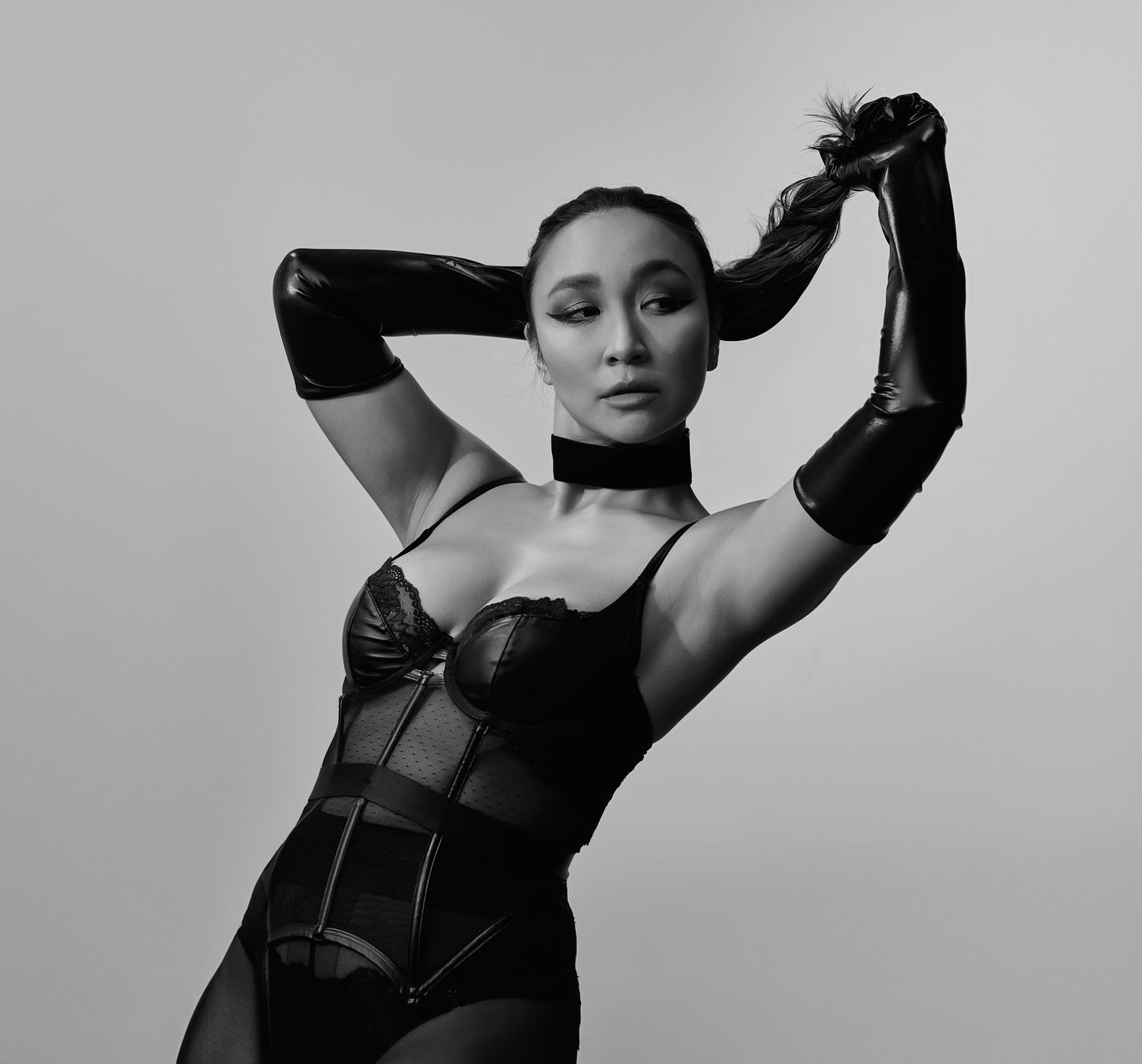Black and white fashion photo series showing dramatic poses in dark clothing.