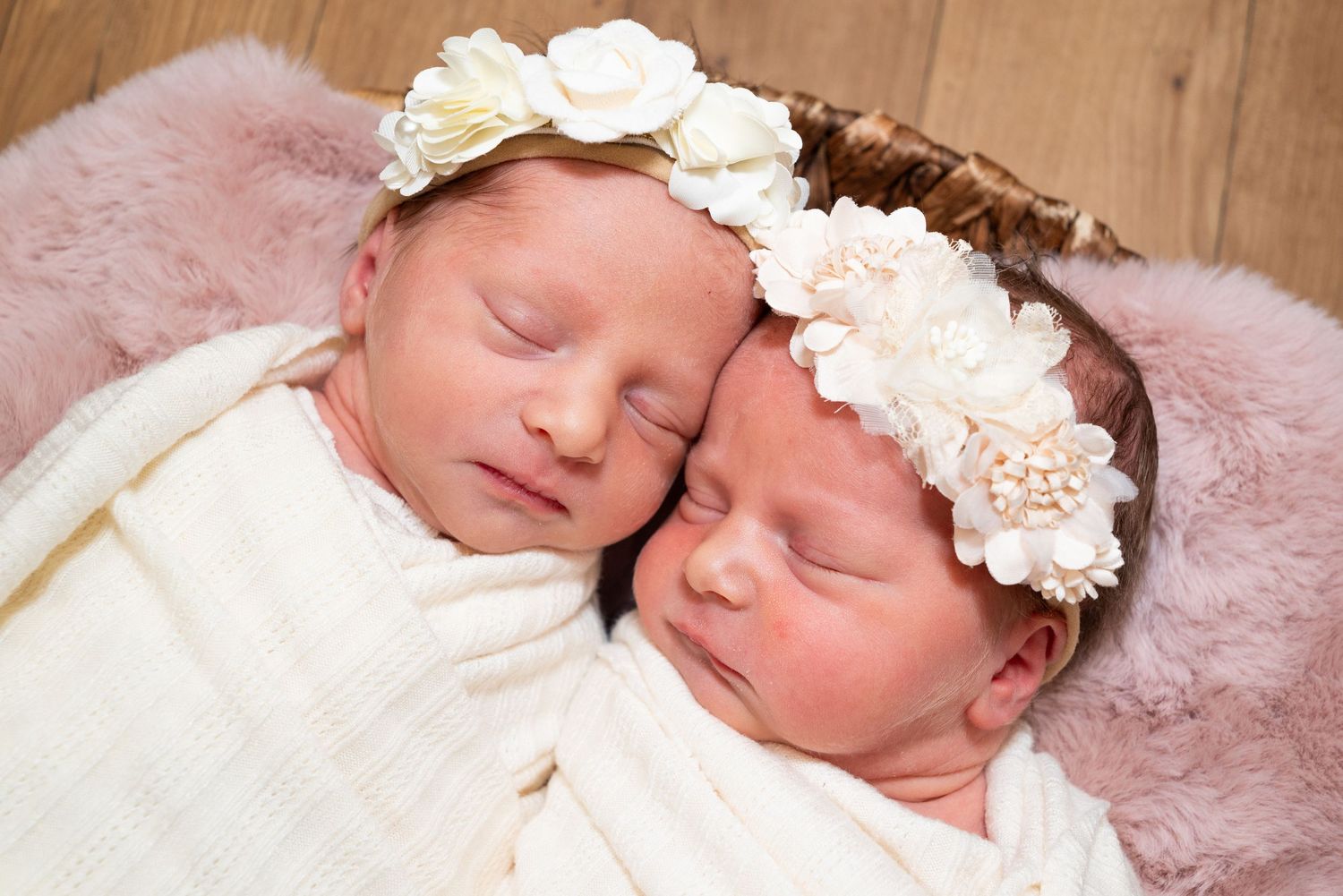 Sleeping newborn wearing delicate floral headband on pink furry backdrop. in hospital newborn photography Bowling green ky glasgow ky