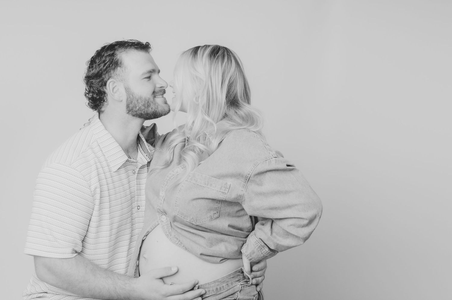 Black and white intimate maternity portraits showing tender moments.