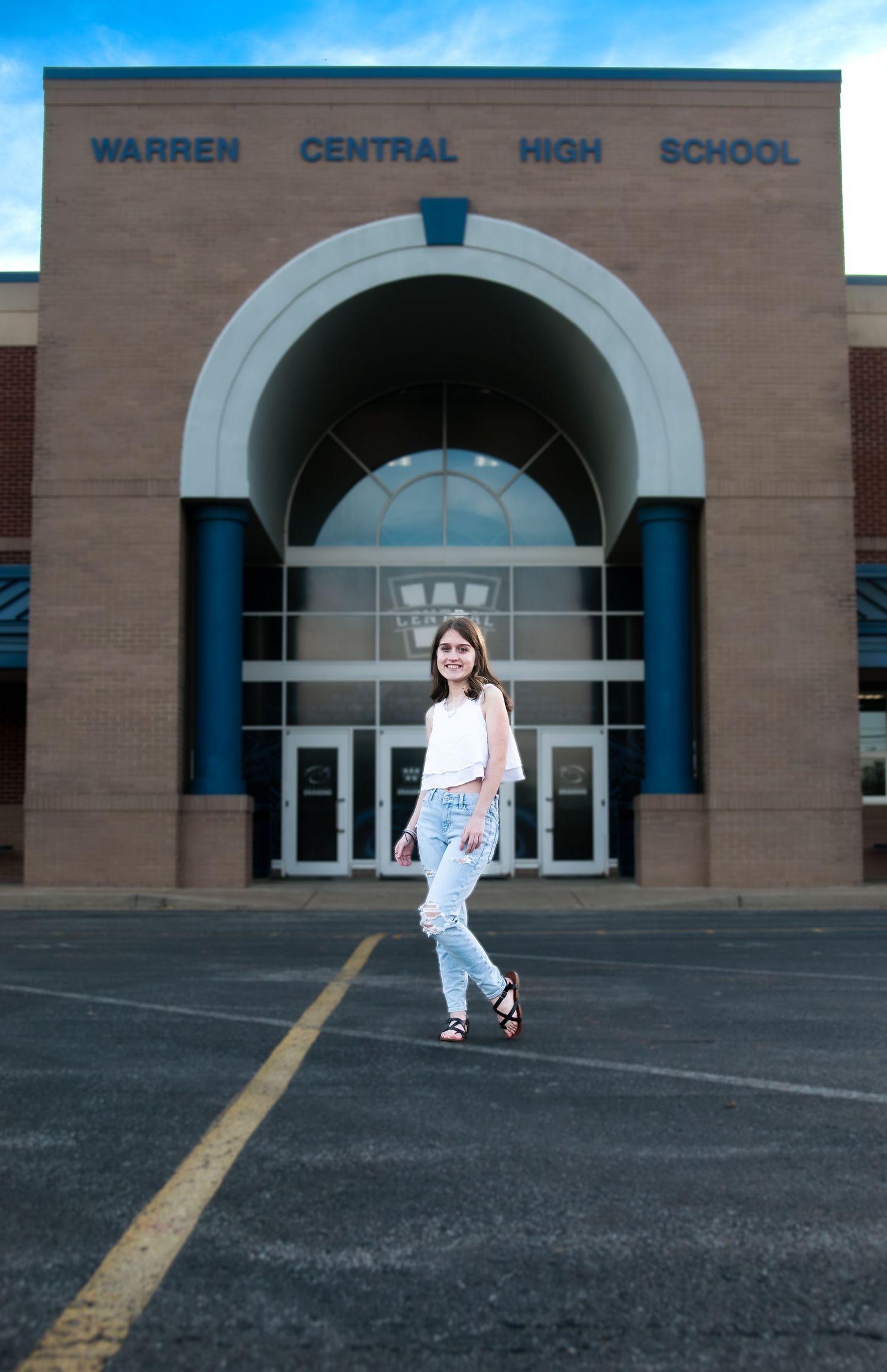 High school exterior view showing Warren Central High School entrance with arched windows. Senior photography SOKY