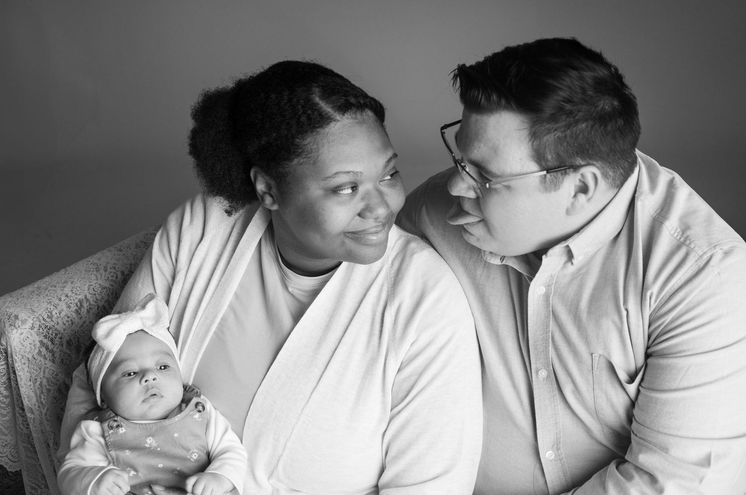 Black and white intimate family portrait session with newborn in soft lighting. Silly family photos studio SOKY franklin ky bowling green ky