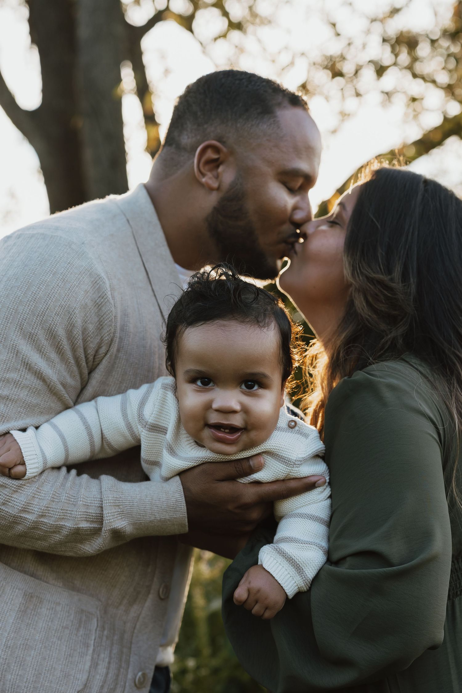 A heartwarming family photo sequence showing tender moments between parents and their baby in outdoor natural lighting.