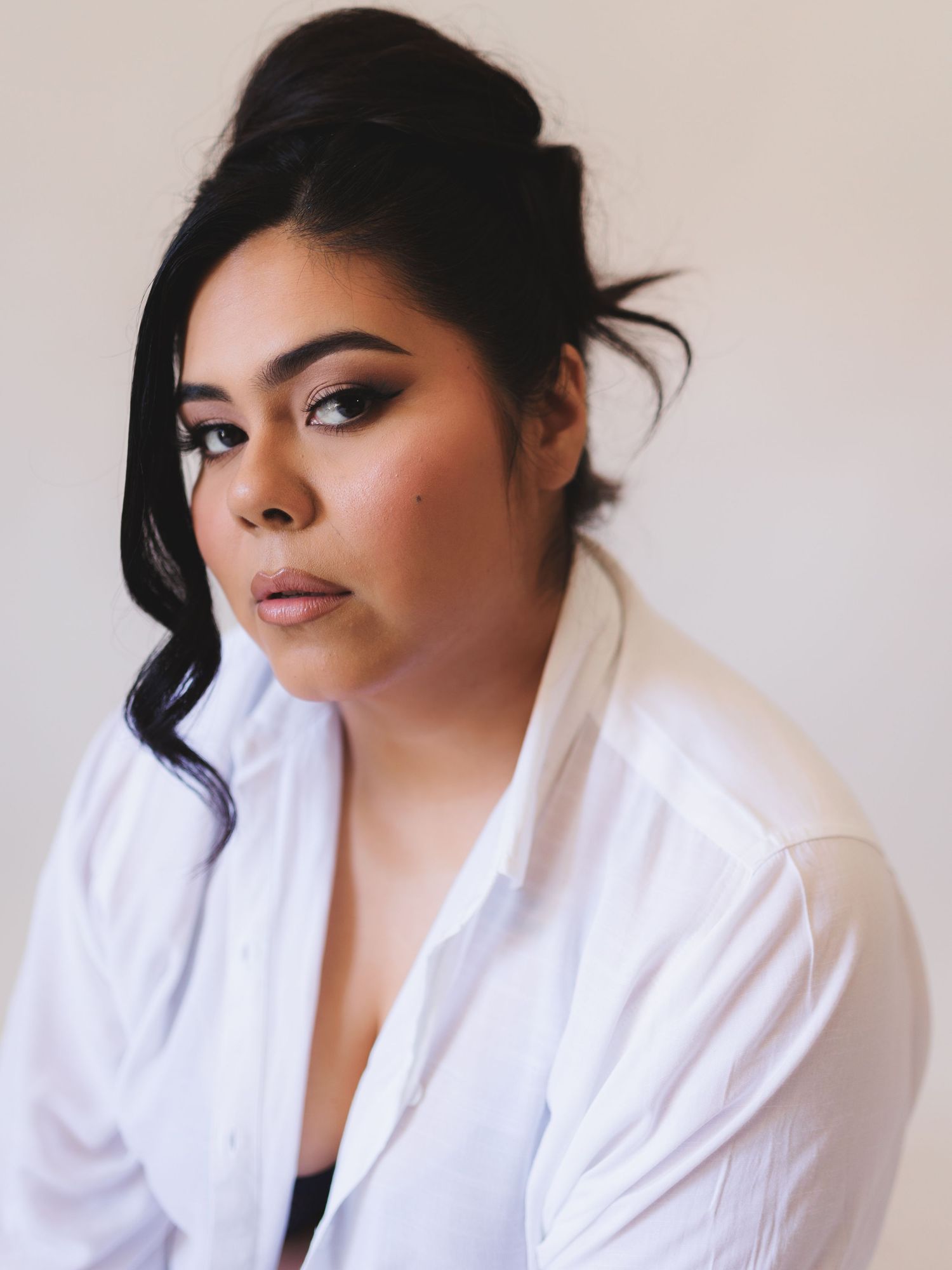 Close-up portrait series showing glamorous makeup and styled dark hair against neutral background.