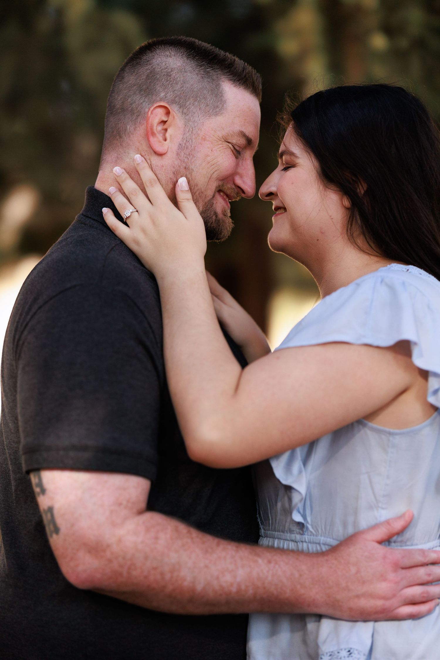 Romantic embrace captured in a series of intimate moments outdoors.