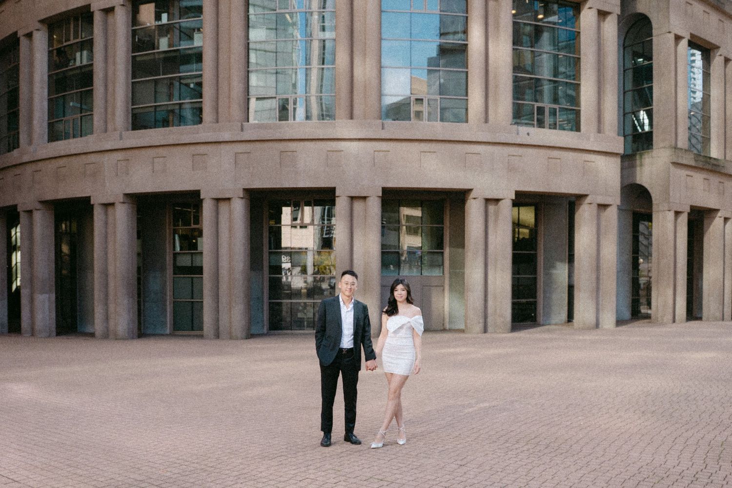 Couple in front of Vancouver Public Library. Vancouver prewedding and engagement by Victor Li Photography.