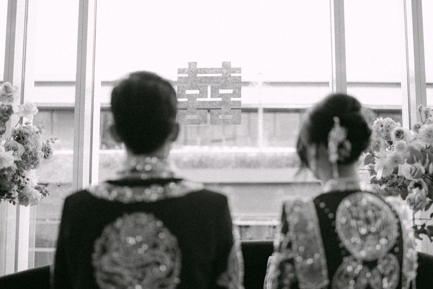 Bride and groom kneeling at tea ceremony. Vancouver wedding by Victor Li Photography.