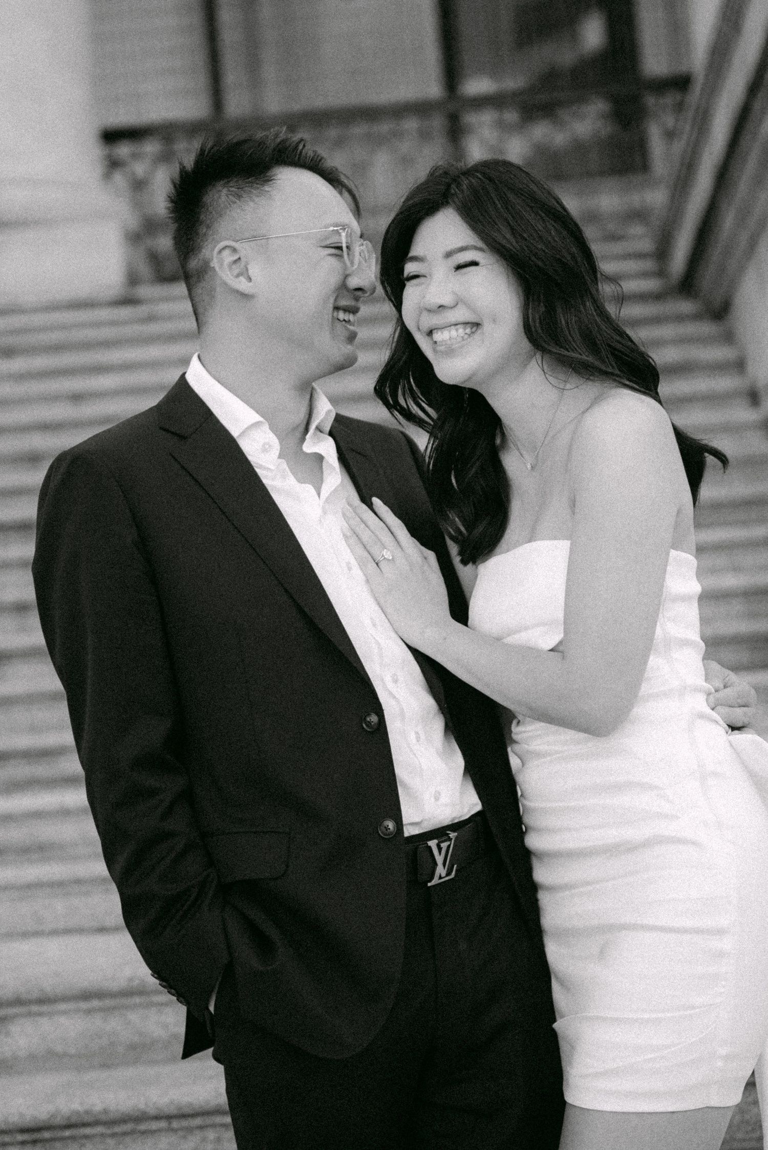 Couple on steps of Vancouver Art Gallery. Vancouver prewedding and engagement by Victor Li Photography.