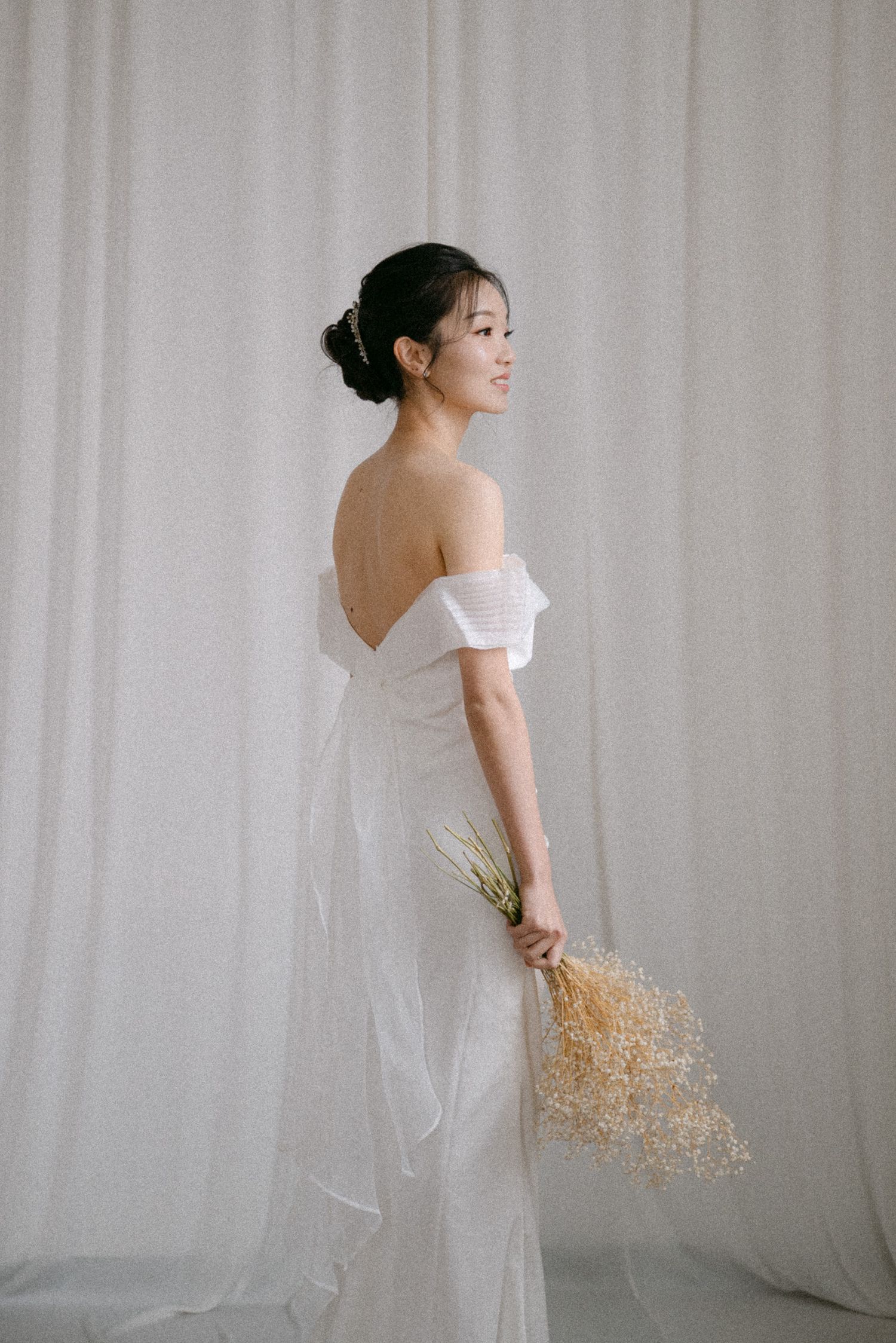 Bride holding florals. Vancouver studio prewedding by Victor Li Photography.