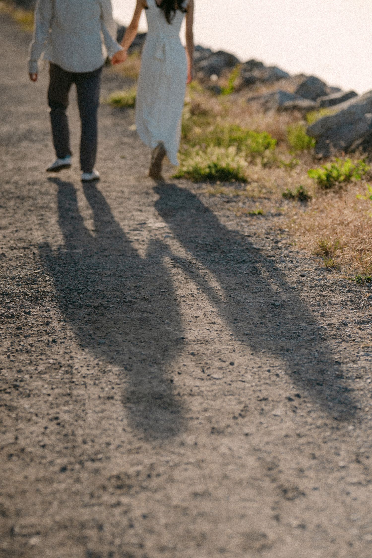 Shadow of couple walking at Terra Nova Park. Vancouver prewedding and engagement by Victor Li Photography.