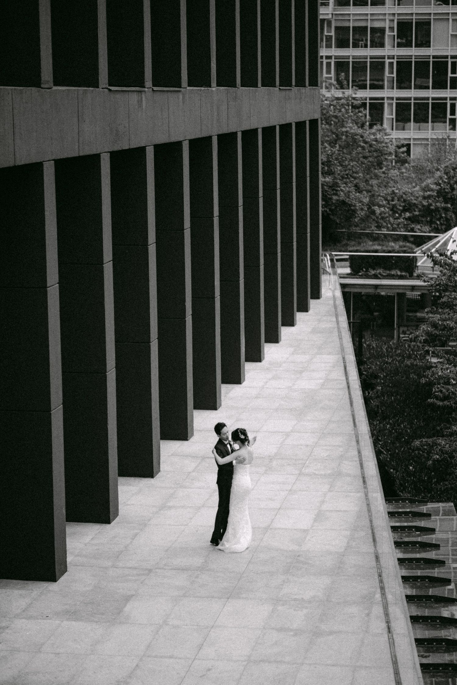 Couple dancing in heart of downtown. Vancouver wedding by Victor Li Photography.