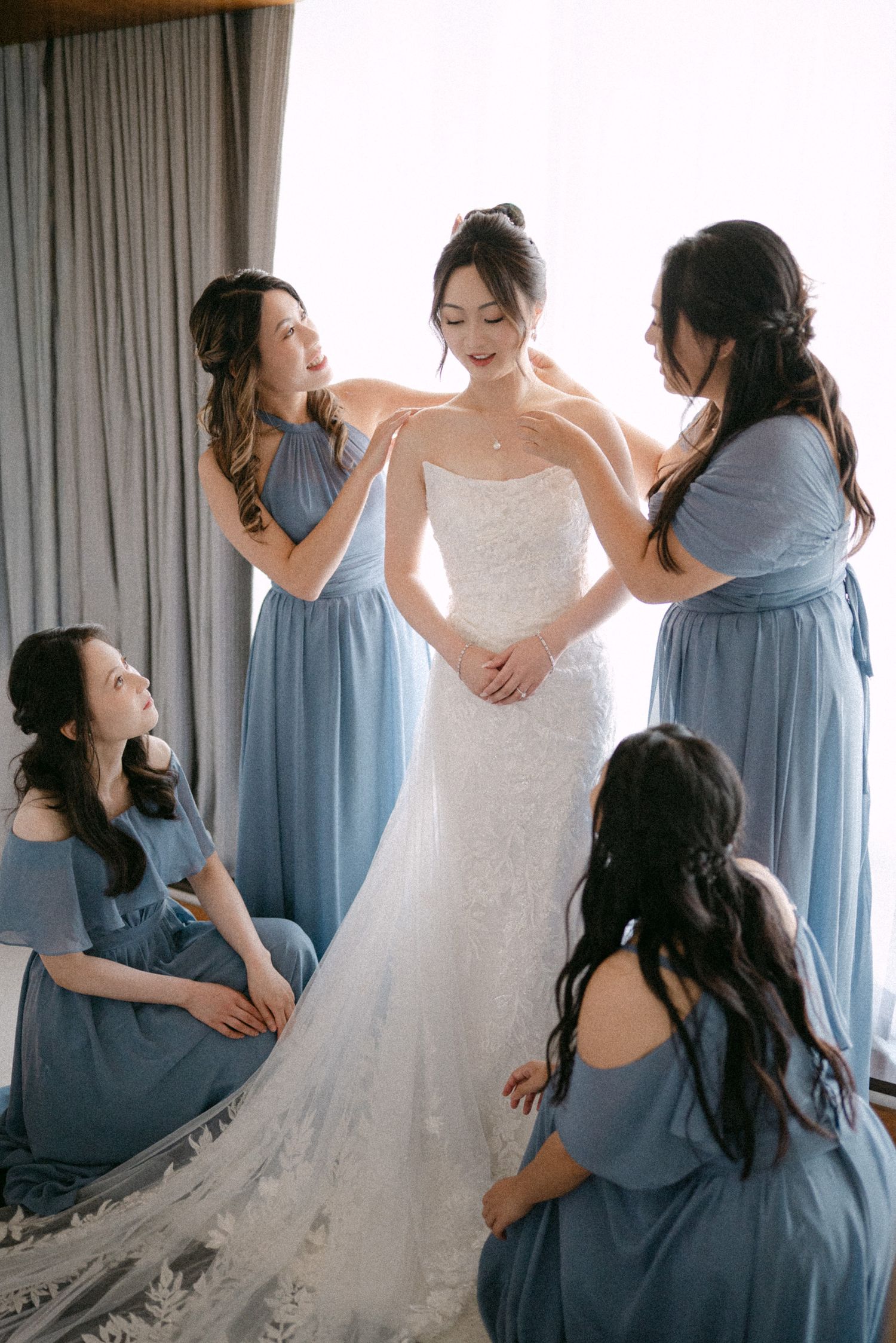 Bride getting ready with bridesmaids. Vancouver wedding by Victor Li Photography.