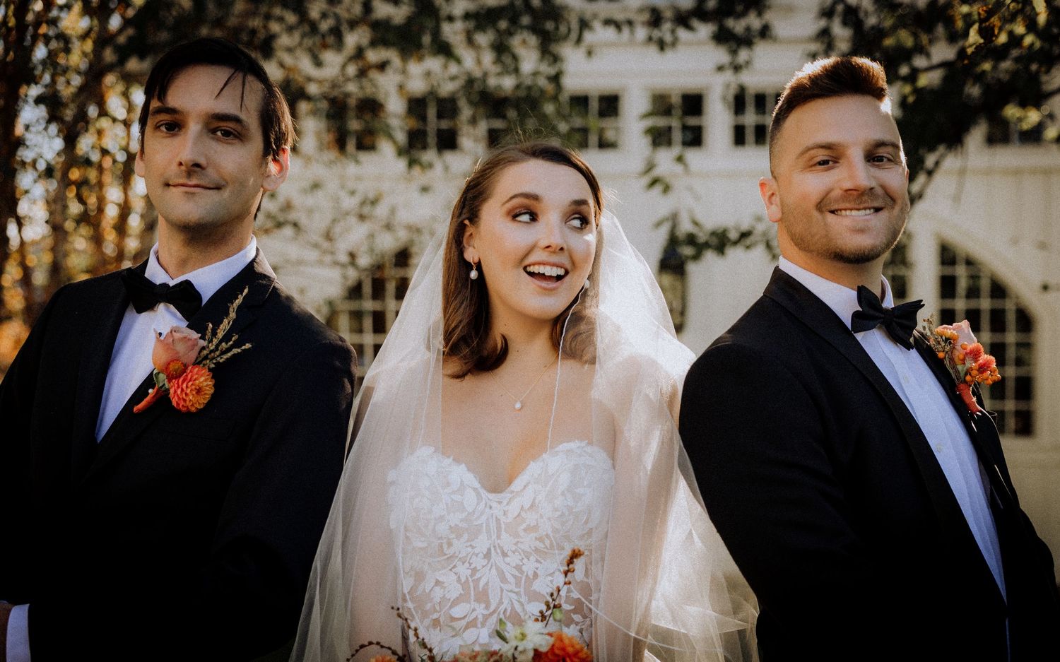 Wedding party members share candid moments during an outdoor celebration.
