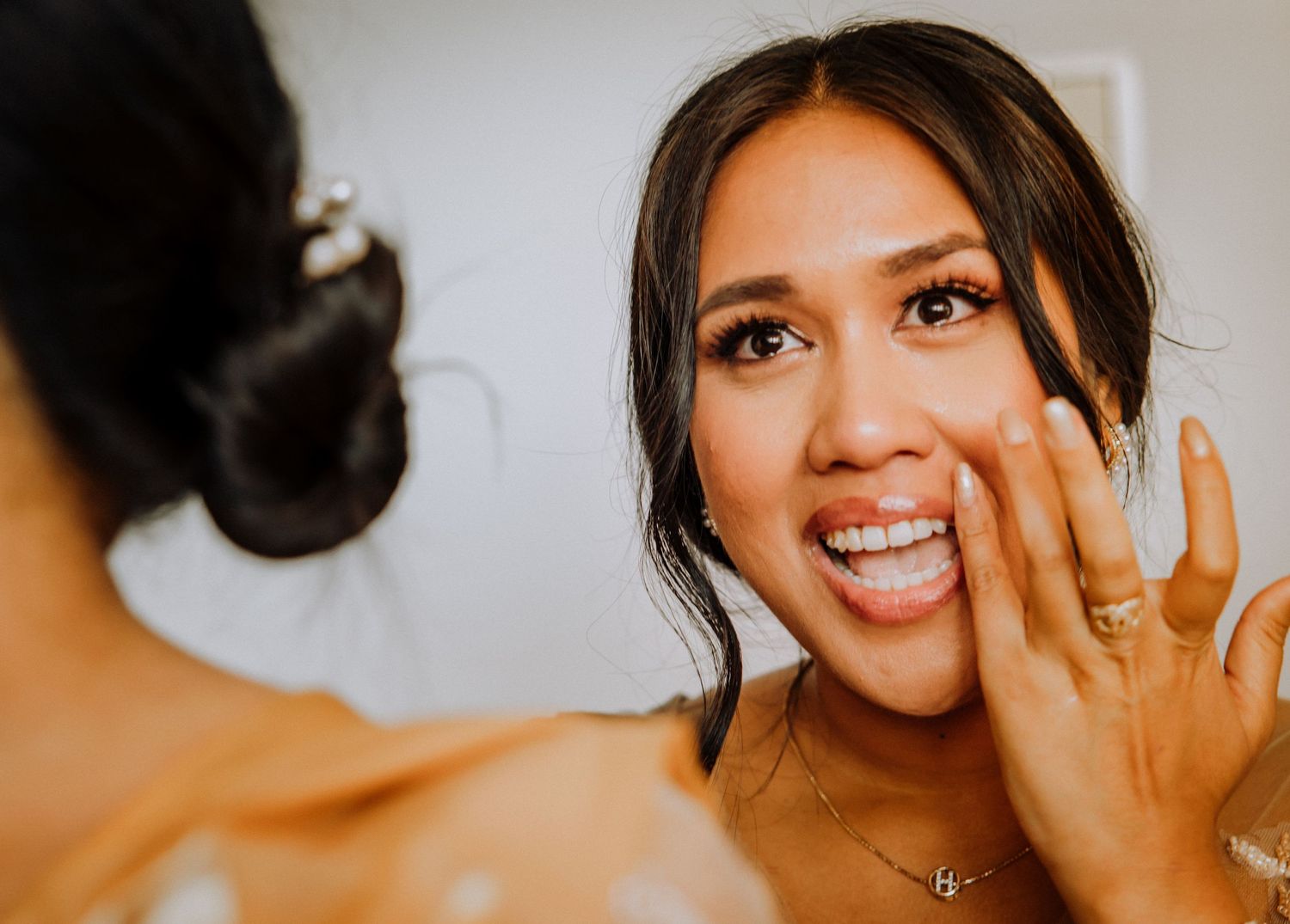 A series of photographs showing different joyful expressions and poses with a sparkly engagement ring.