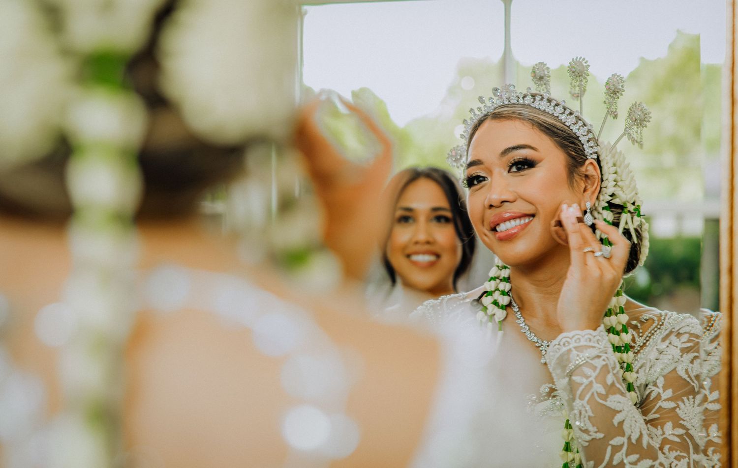 A beautiful outdoor wedding ceremony with floral arrangements and greenery decorating the scenic venue.