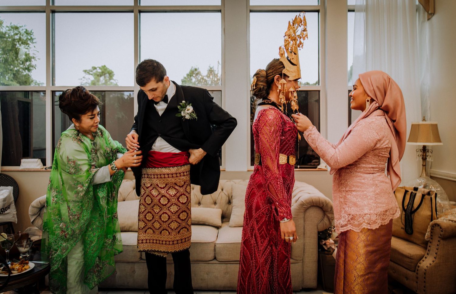 Beautiful reflection of elegant wedding attire captured in decorative mirror with ornate golden frame details.