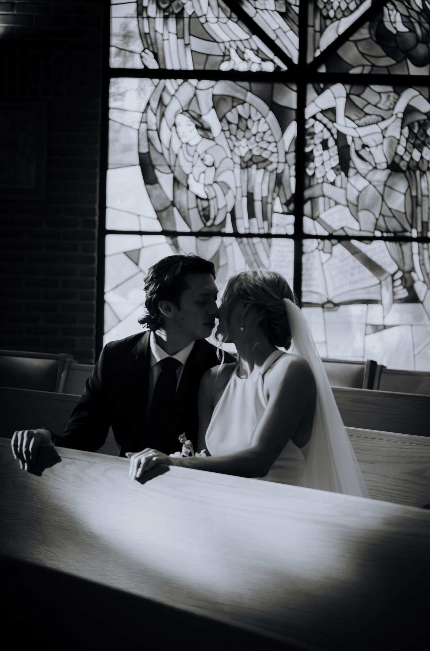 A romantic black and white photo sequence showing a couple in silhouette sharing an intimate moment at a table.