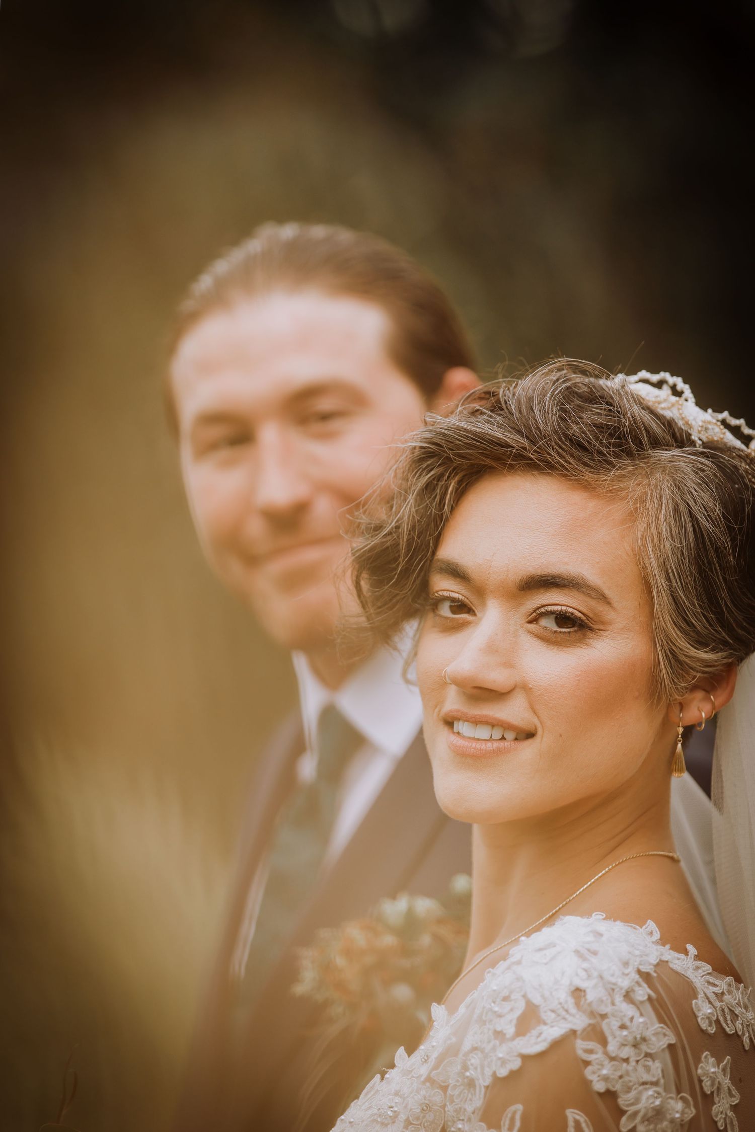 Warm-toned portrait of wedding party in natural lighting.