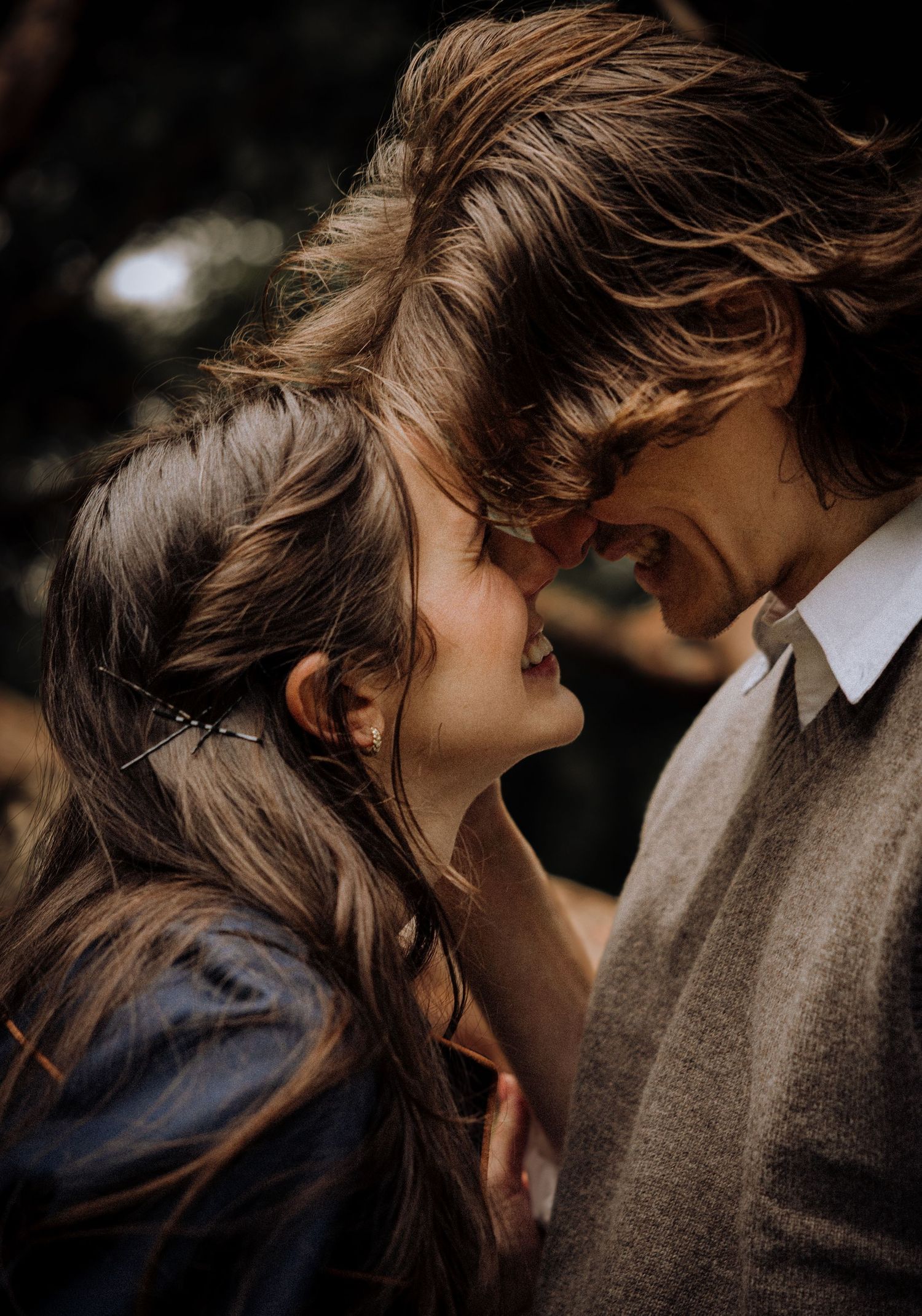 Close-up shots of a couple sharing intimate moments with soft lighting and natural expressions.