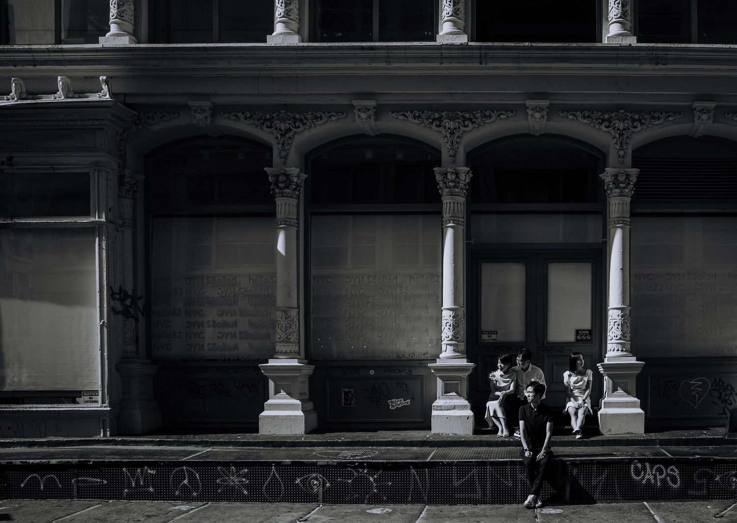 Historic building facade with ornate columns and arches creates dramatic architectural backdrop.