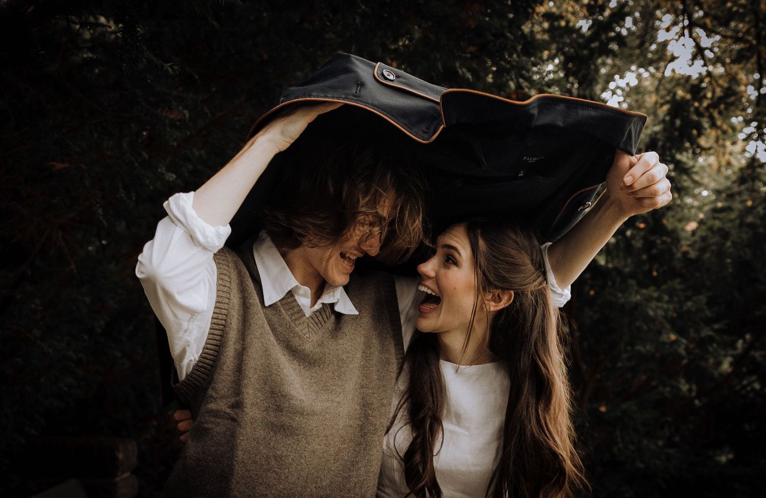 A romantic dance sequence captured in moody lighting outdoors.