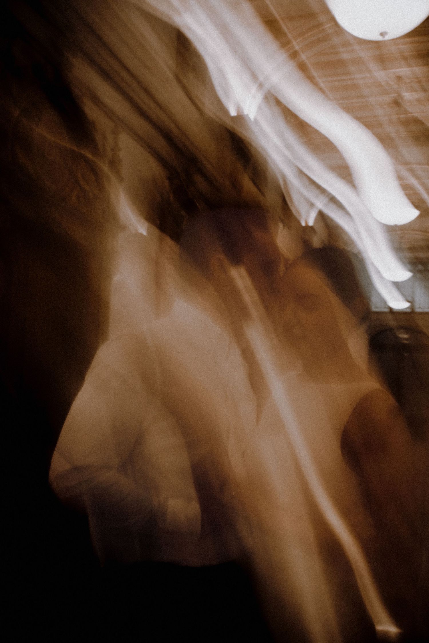 Abstract blurred motion photograph in sepia tones creating an ethereal artistic effect.