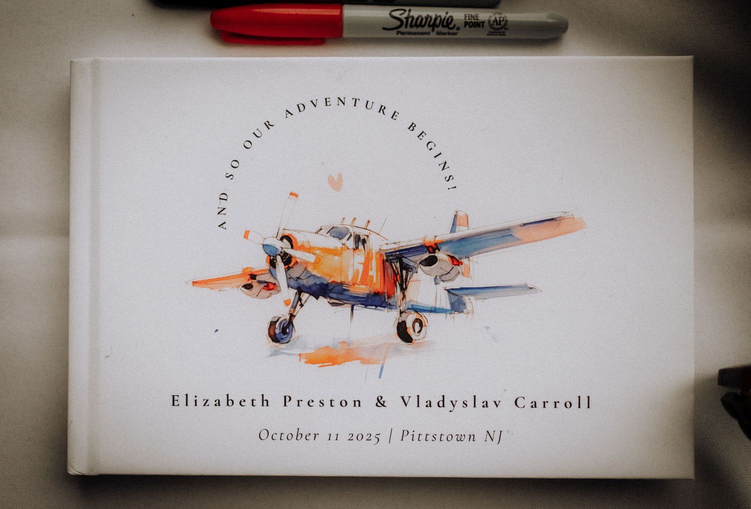 Wedding stationery design featuring vintage airplane illustration and text.