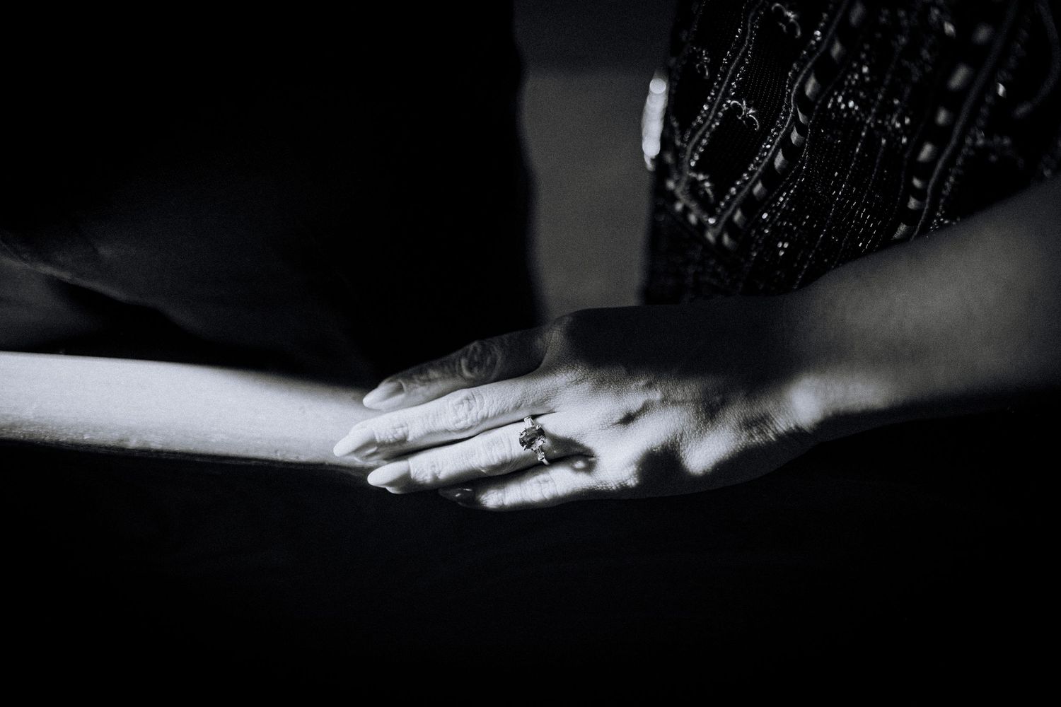 An artistic black and white close-up detail shot in dramatic lighting.