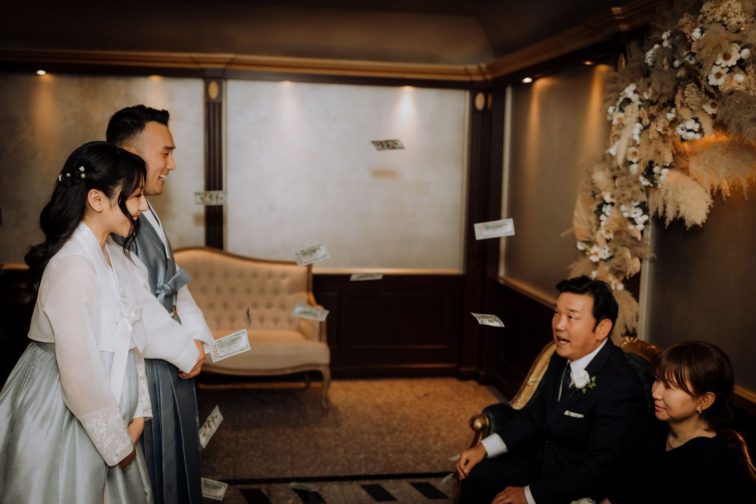 Wedding reception venue with elegant indoor lighting and decorative elements.