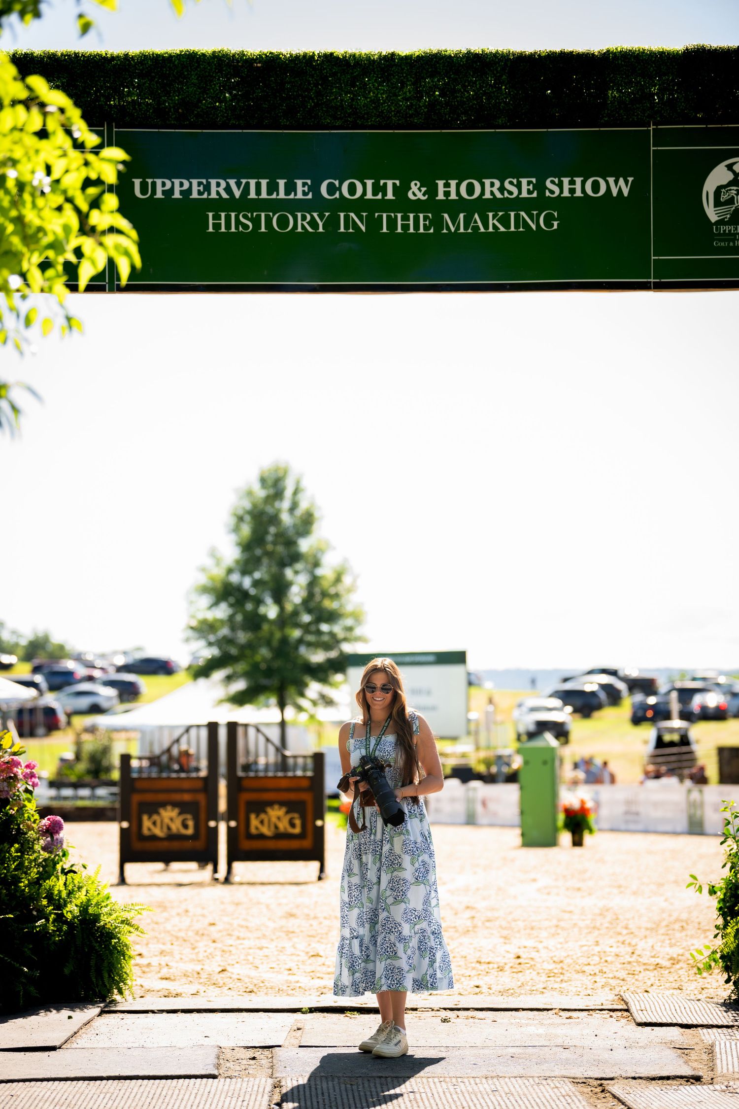 Entrance sign for the Upperville Colt & Horse Show with greenery in background.